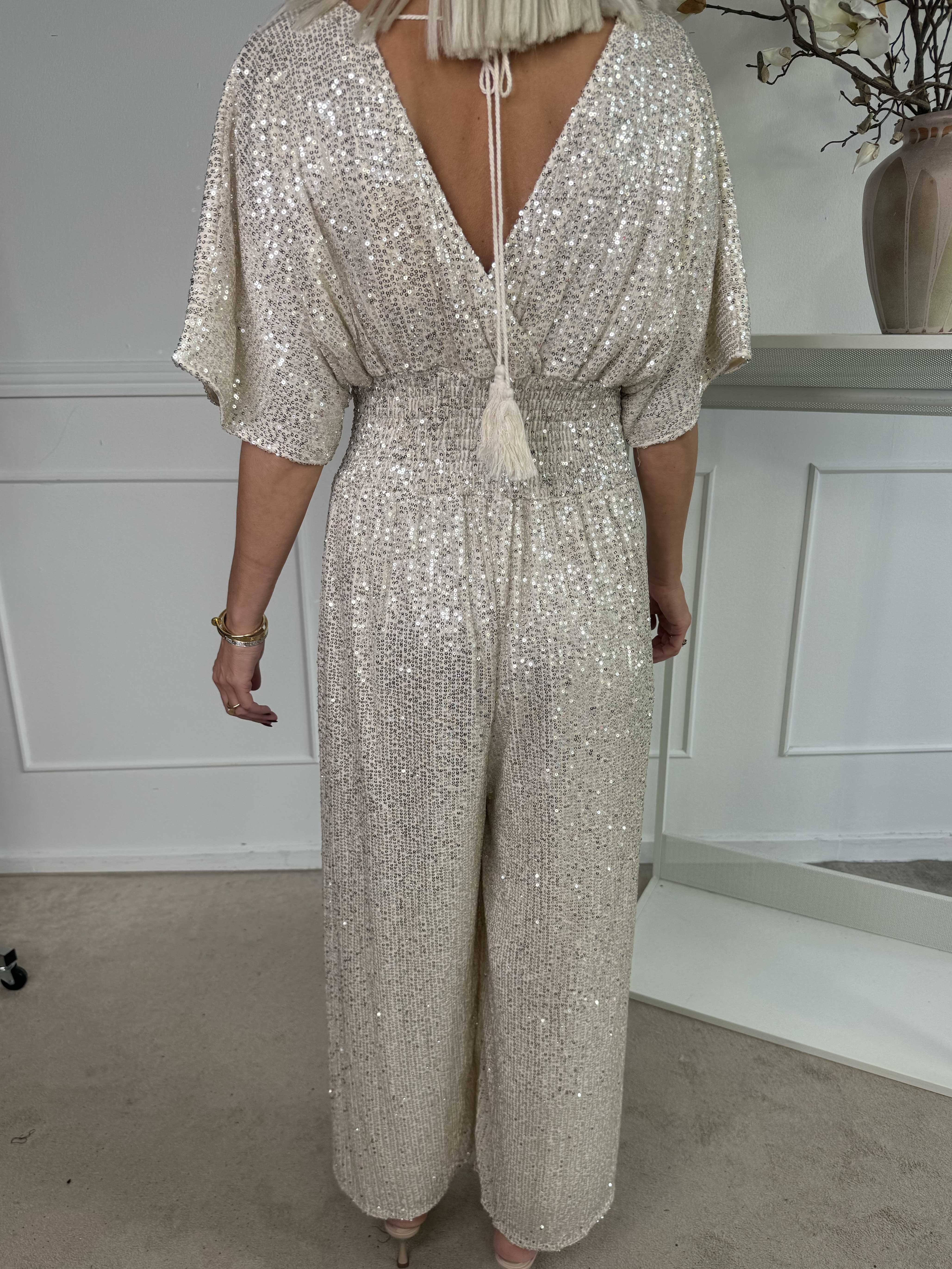 Pams Glitter Jumpsuit - Elastisk jumpsuit med smock och paljetter